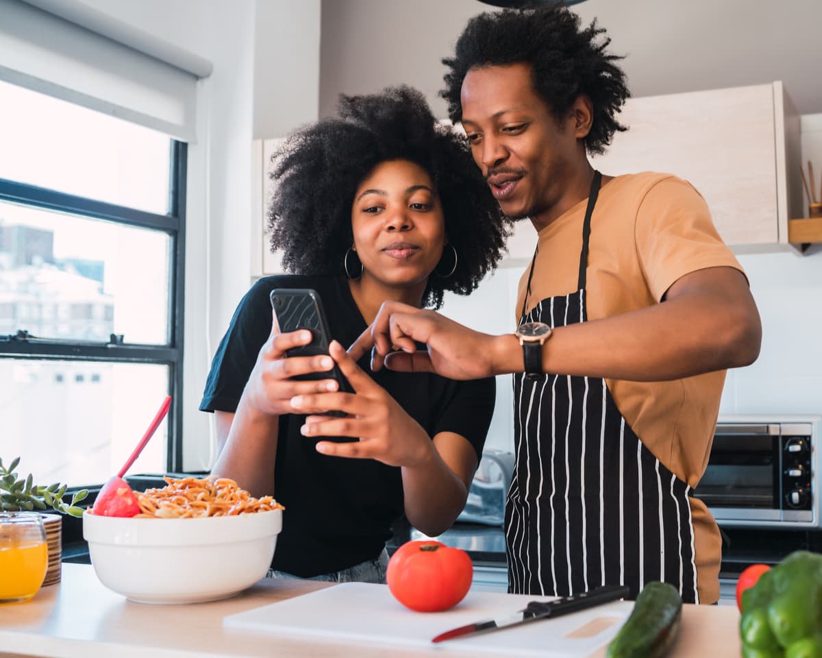 Kenyan woman cooking in a modern kitchen